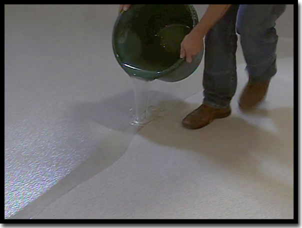 Application of LABFAST LO 85 polyaspartic resin as a UV-stable top coat for a Poly-Quartz garage floor. This professional-grade coating features 150% elongation at break to handle Minnesota temperature swings and ensures a non-yellowing, high-traction safety finish.