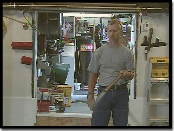 Concrete Renewal owner Greg Richard preparing the specialized blower for the 'Quartz Suit of Armor' broadcast, Step 5 of the industrial-grade Poly-Quartz garage floor coating process in the Twin Cities, MN.