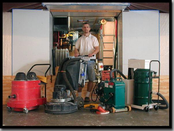 Shows me and my equipment standing in front of trailer